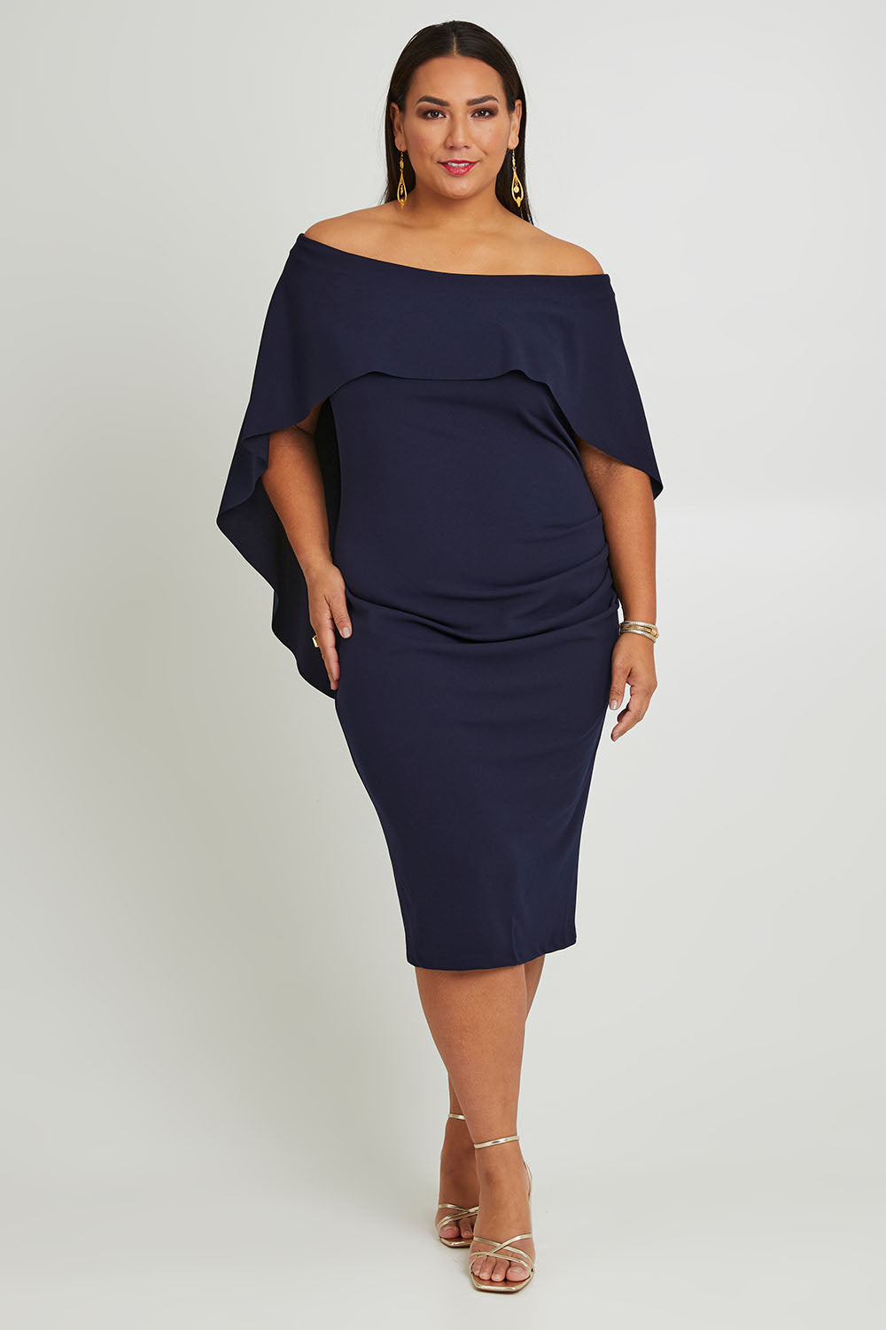Model Ashleigh wearing size 16 of the Cora Dress in colour Navy (Blue), from the front, showing the whole outfit