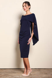 Model Maddiec wearing size 10 of the Cora Dress - Navy in colour Navy, from the front
