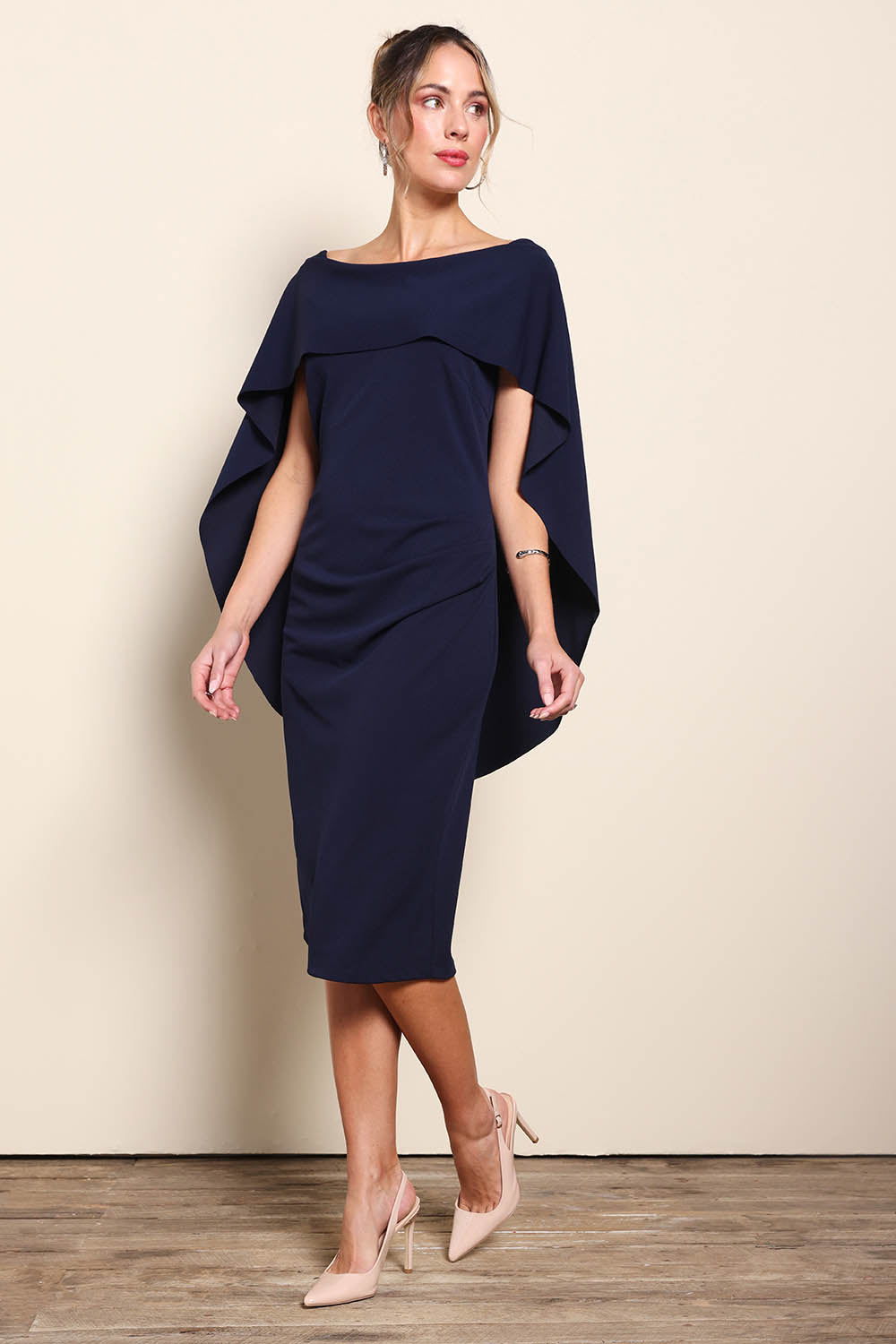 Model Maddiec wearing size 10 of the Cora Dress - Navy in colour Navy, from the front