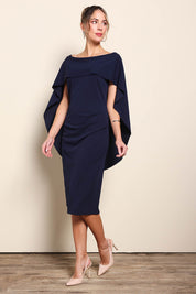 Model Maddiec wearing size 10 of the Cora Dress - Navy in colour Navy, from the front