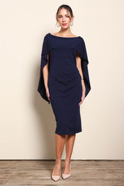 Model Maddiec wearing size 10 of the Cora Dress - Navy in colour Navy, from the front