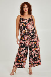 Model Maddy wearing size 16 of the Mia Pants in colour Floral (Black), from the front, showing the whole outfit