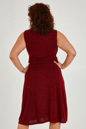 Model Maddy wearing size 16 of the Alex Dress in colour Flame (Red), from the back