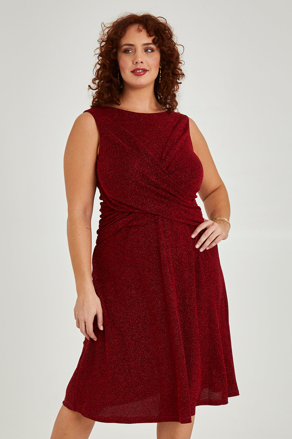 Model Maddy wearing size 16 of the Alex Dress in colour Flame (Red), from the front, cropped image