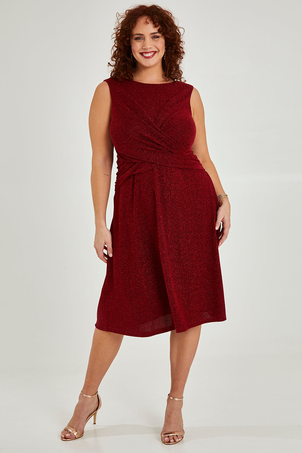 Model Maddy wearing size 16 of the Alex Dress in colour Flame (Red), from the front, showing the whole outfit