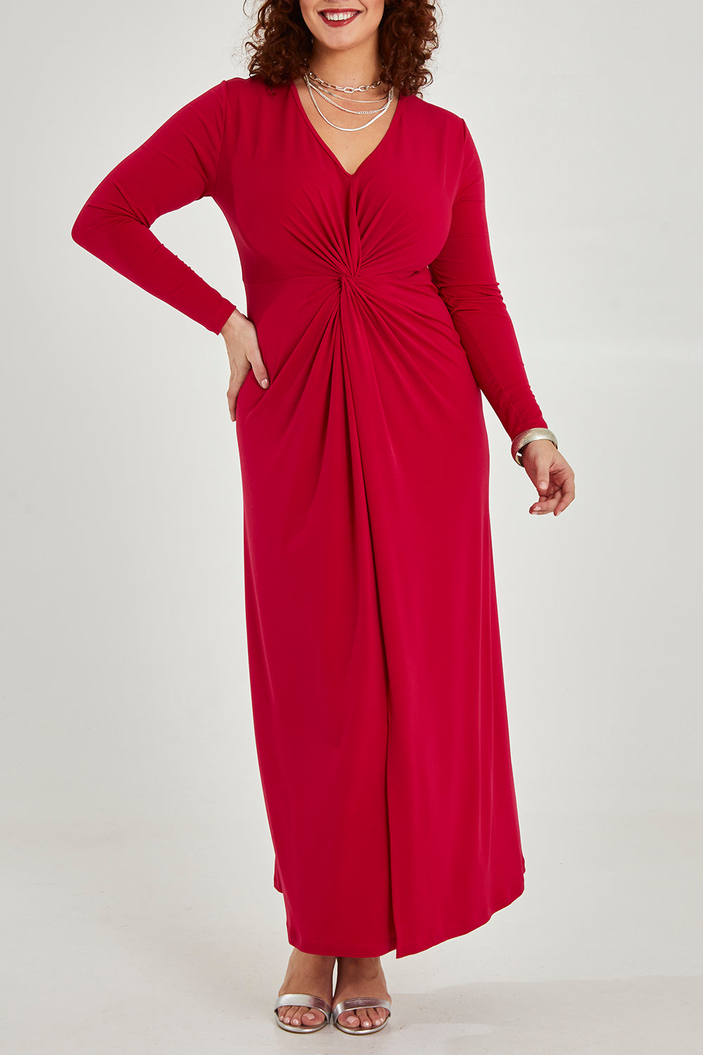 Model Maddy wearing size 16 of the Francesca Dress in colour Granita (Red), from the front, cropped image