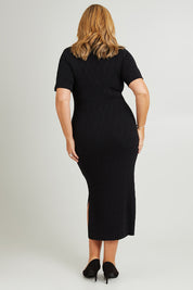 Model Fiona wearing size XL of the Astrid Dress in colour Black (Black), from the back