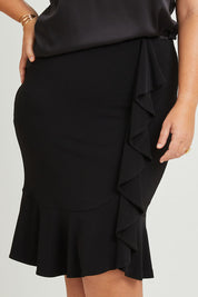 Model Fiona wearing size 16 of the Eva Skirt in colour Black (Black), from the front, cropped image