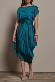 Model Amanda wearing size S of the Hayley Dress in colour Ocean (Green), from the front, cropped image