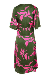 Product shot of the Ailin Wrap Dress in colour Vividflora (Green), from the back