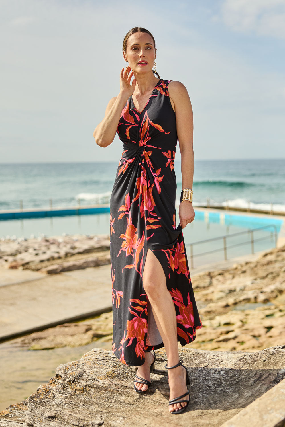 Model Clementine wearing size 10 of the Frankie Dress in colour Firelight (Black), from the front, showing the whole outfit