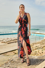 Model Clementine wearing size 10 of the Frankie Dress in colour Firelight (Black), from the front, showing the whole outfit