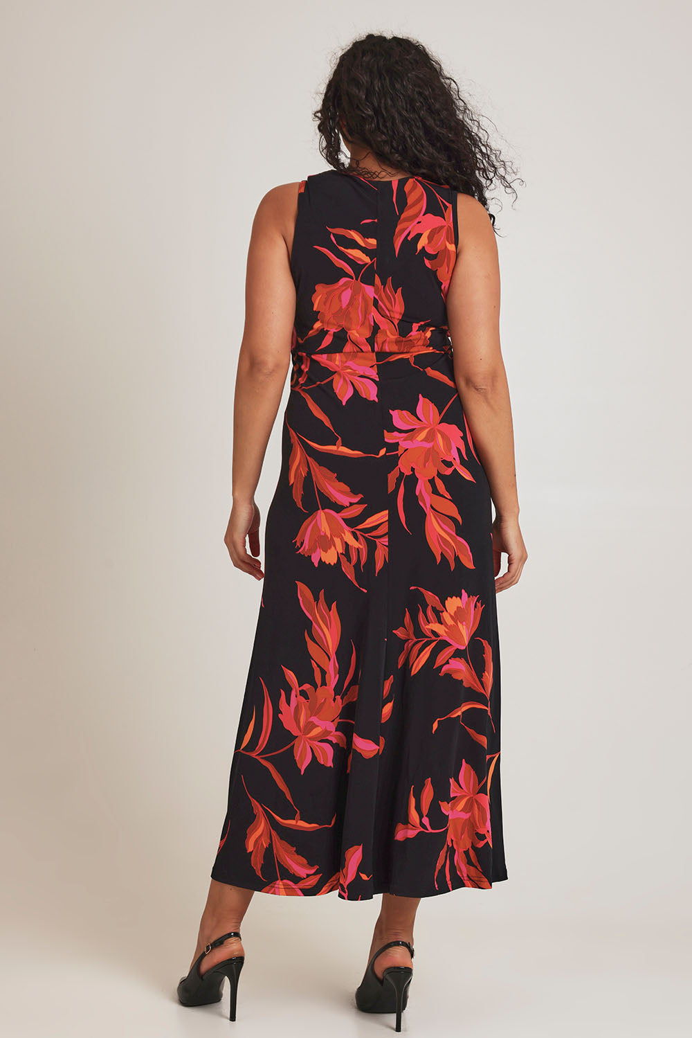 Model Terri-Leigh wearing size 14 of the Frankie Dress in colour Firelight (Black), from the back