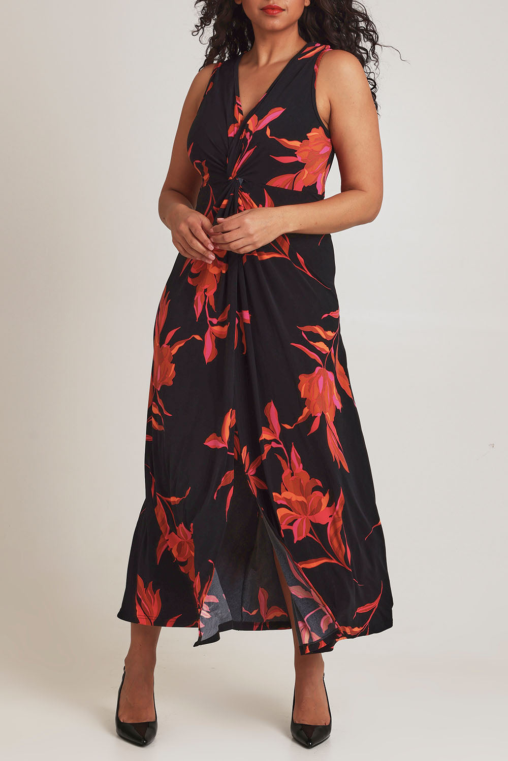 Model Terri-Leigh wearing size 14 of the Frankie Dress in colour Firelight (Black), from the front, cropped image