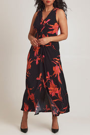 Model Terri-Leigh wearing size 14 of the Frankie Dress in colour Firelight (Black), from the front, cropped image