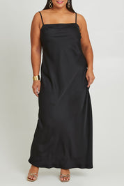 Model Ashleigh wearing size 16 of the Katie Dress in colour Black (Black), from the front, cropped image