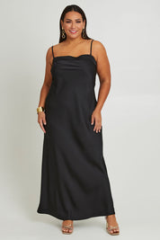 Model Ashleigh wearing size 16 of the Katie Dress in colour Black (Black), from the front, showing the whole outfit