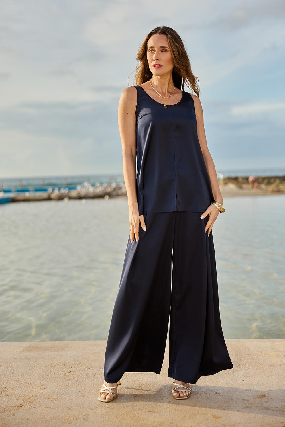 Model Clementine wearing size 10 of the Cindy Top in colour Navy (Blue), from the front, showing the whole outfit