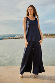Model Clementine wearing size 10 of the Cindy Top in colour Navy (Blue), from the front, showing the whole outfit