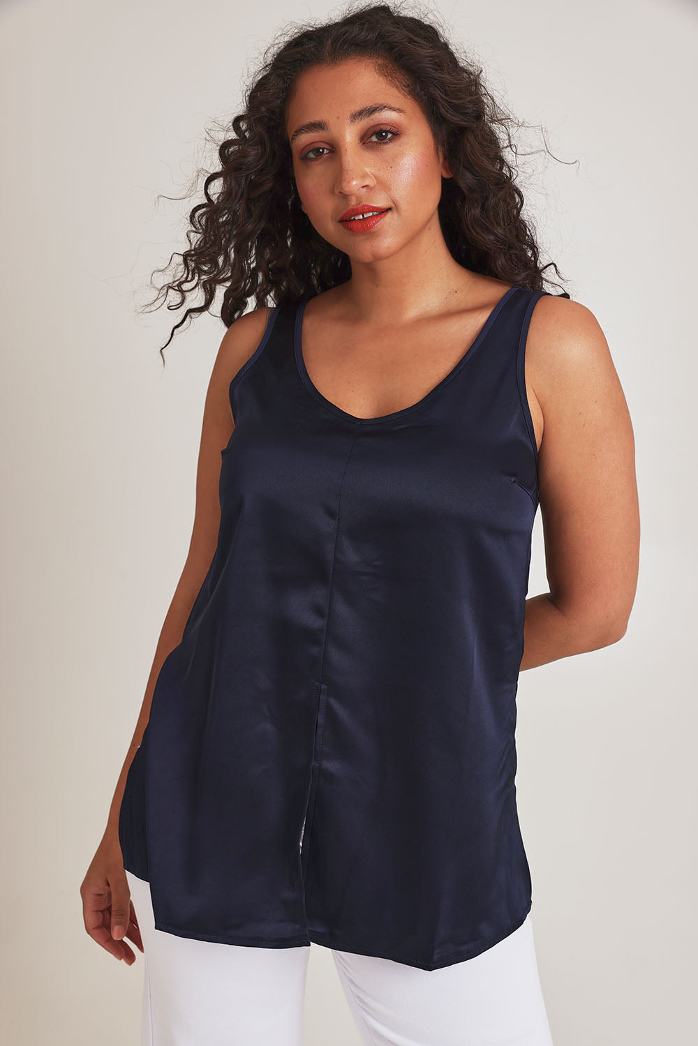 Model Terri-Leigh wearing size 14 of the Cindy Top in colour Navy (Blue), from the front, cropped image