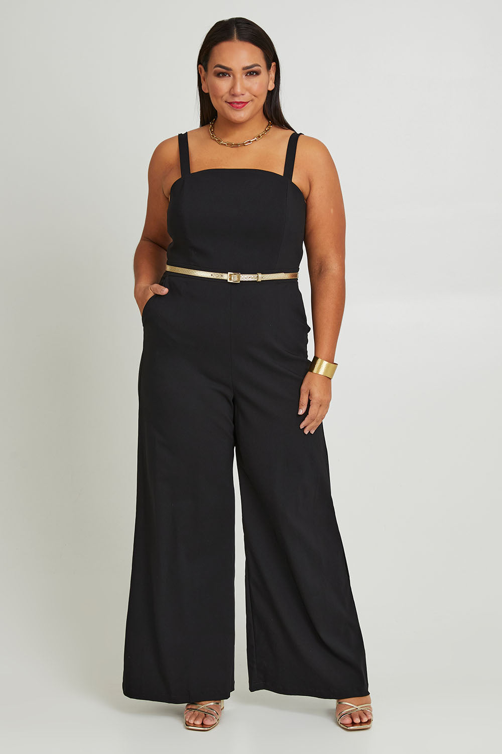 Model Ashleigh wearing size 16 of the Veronica Jumpsuit in colour Black (Black), from the front, showing the whole outfit