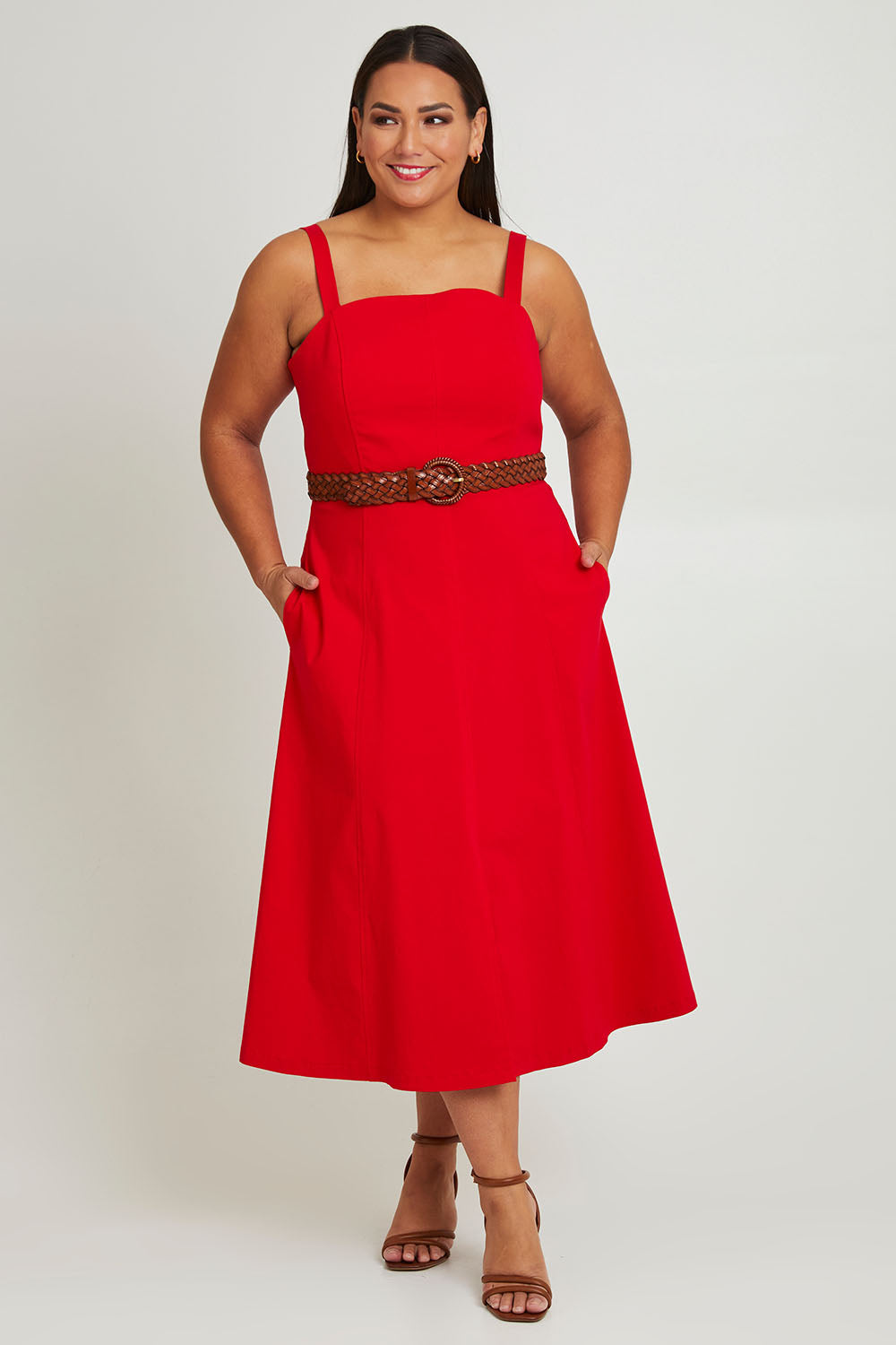 Model Ashleigh wearing size 16 of the Carmen Dress in colour Flame (Red), from the front, showing the whole outfit
