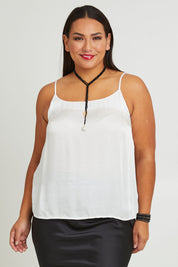 Model Ashleigh wearing size 16 of the Clarice Camisole in colour Snow (White), from the front, cropped image