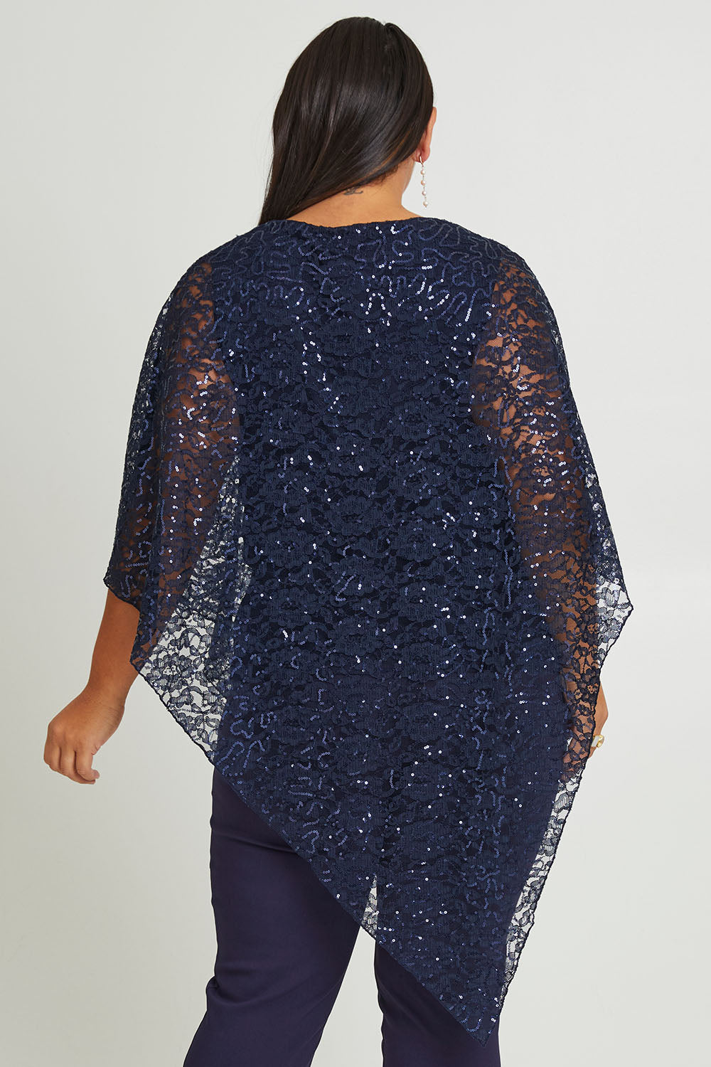 Model Ashleigh wearing size 16 of the Ann Marie Top in colour Navy (Blue), from the back