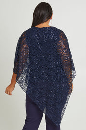 Model Ashleigh wearing size 16 of the Ann Marie Top in colour Navy (Blue), from the back