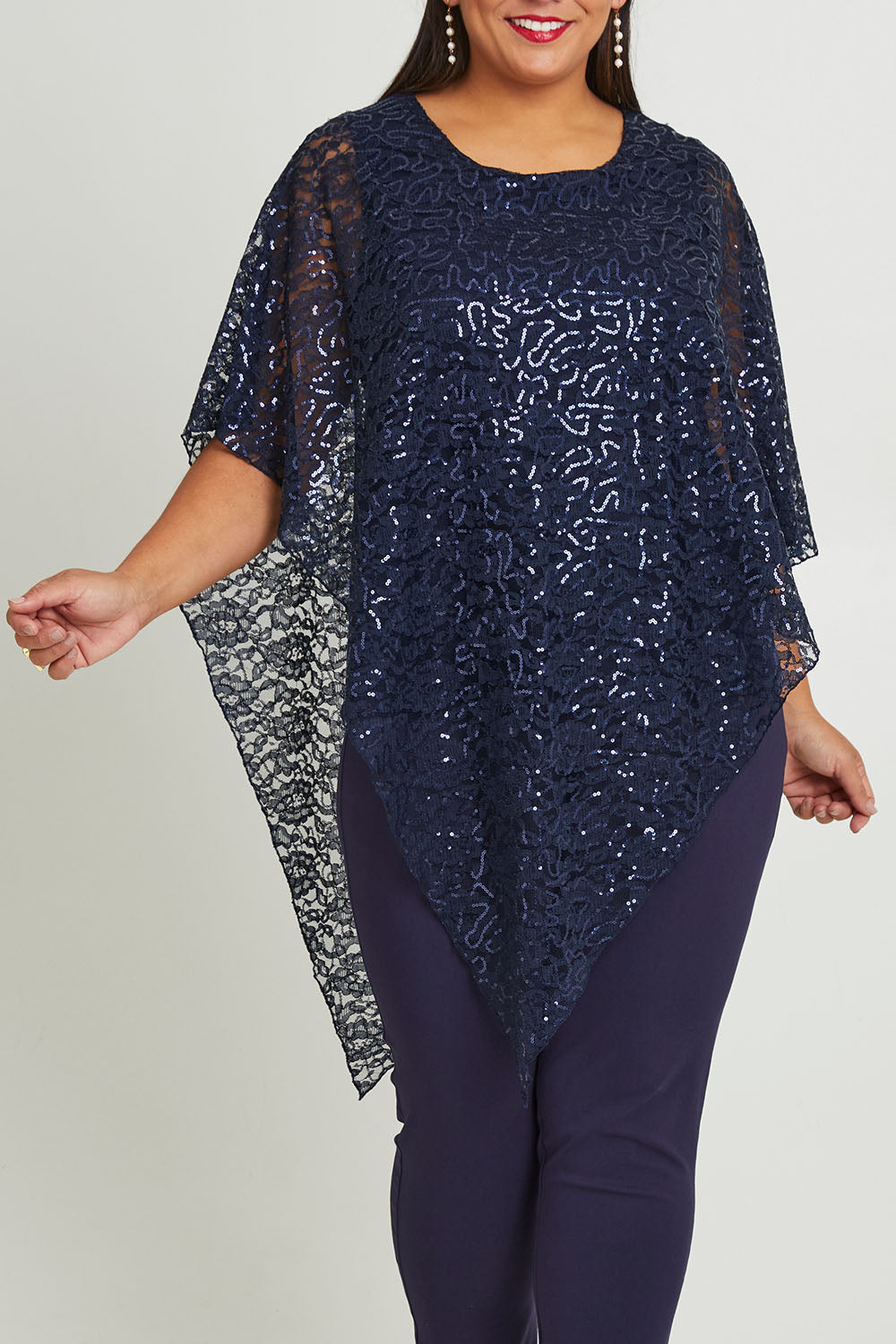Model Ashleigh wearing size 16 of the Ann Marie Top in colour Navy (Blue), from the front, cropped image
