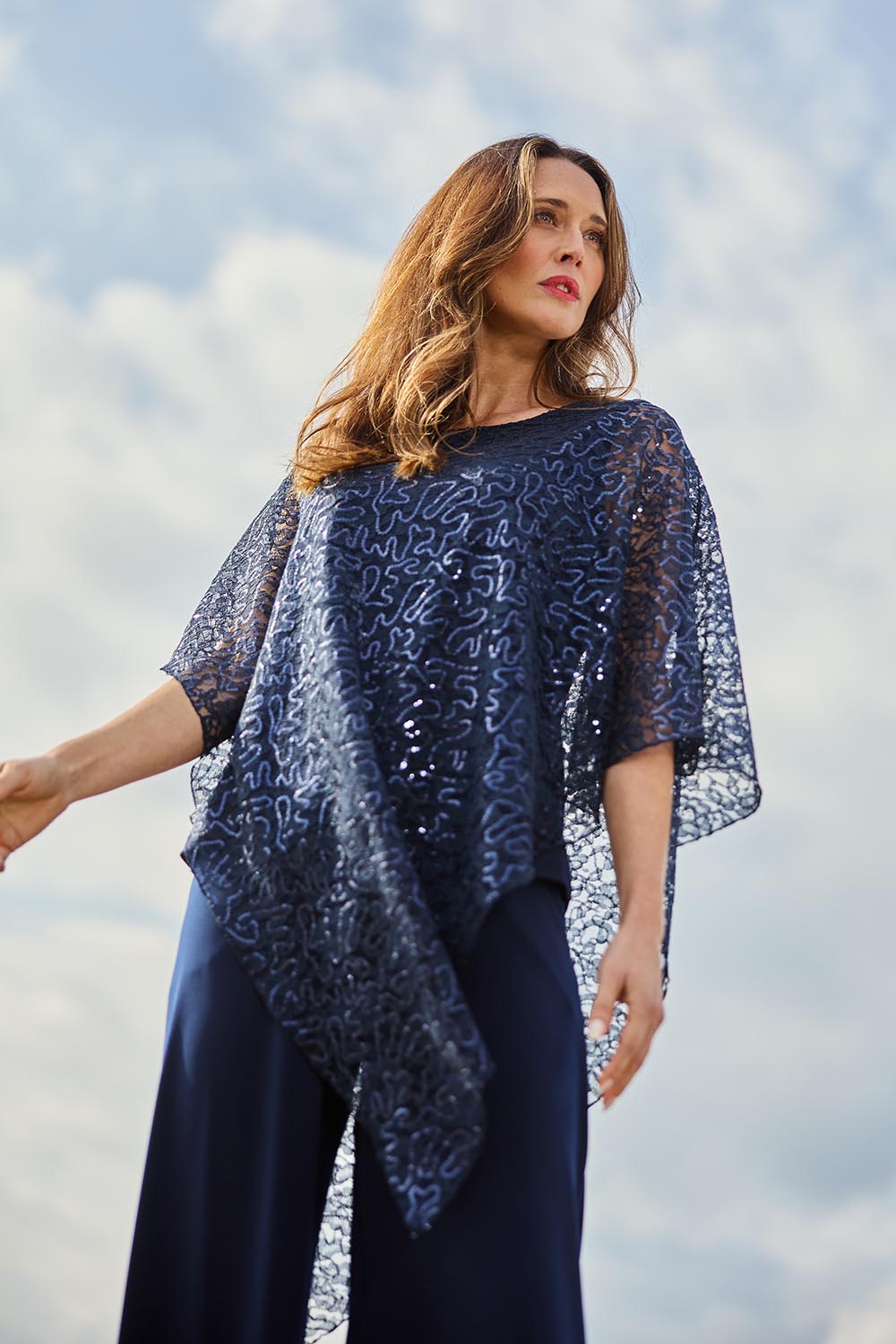Model Clementine wearing size 10 of the Ann Marie Top in colour Navy (Blue), from the front, showing the whole outfit