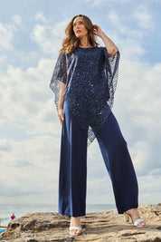 Model Clementine wearing size 10 of the Ann Marie Top in colour Navy (Blue), from the front, showing the whole outfit