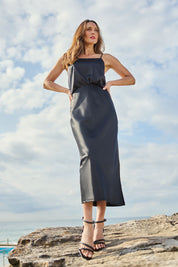 Model Clementine wearing size 10 of the Sienna Skirt in colour Black (Black), from the front, showing the whole outfit