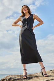 Model Clementine wearing size 10 of the Sienna Skirt in colour Black (Black), from the front, showing the whole outfit