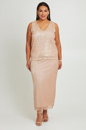 Model Ashleigh wearing size 16 of the Sherri Skirt in colour Amber (Metallics), from the front, showing the whole outfit
