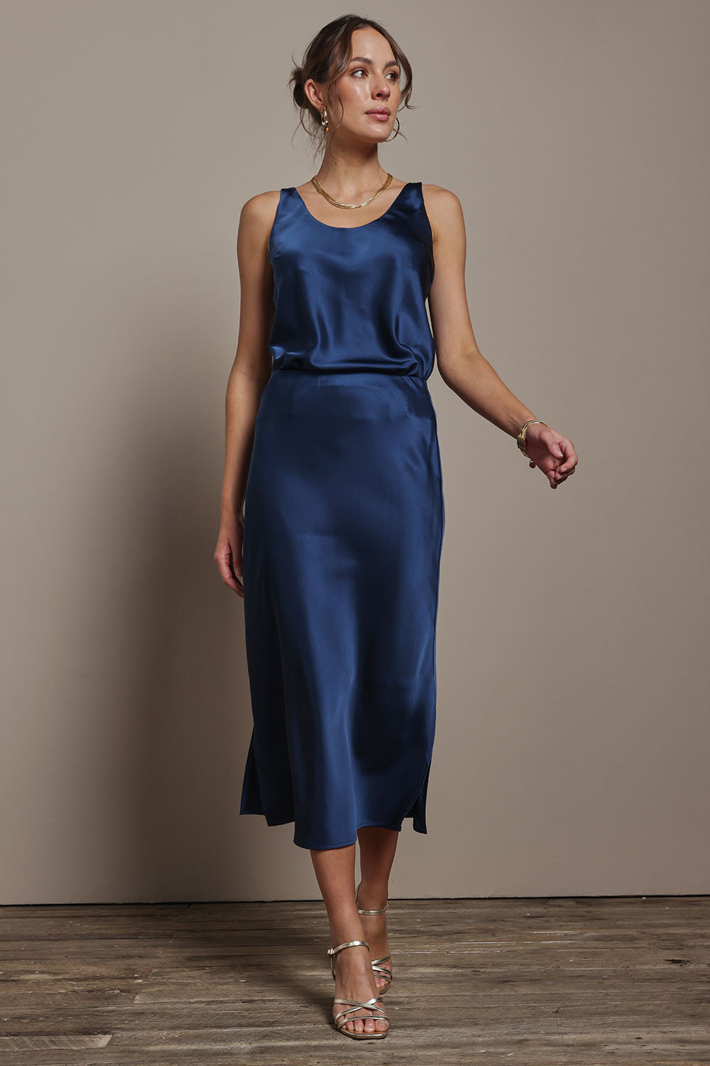 Model Madeline wearing size 10 of the Loulou Satin Skirt in colour Steelblue (Blue), from the front, showing the whole outfit
