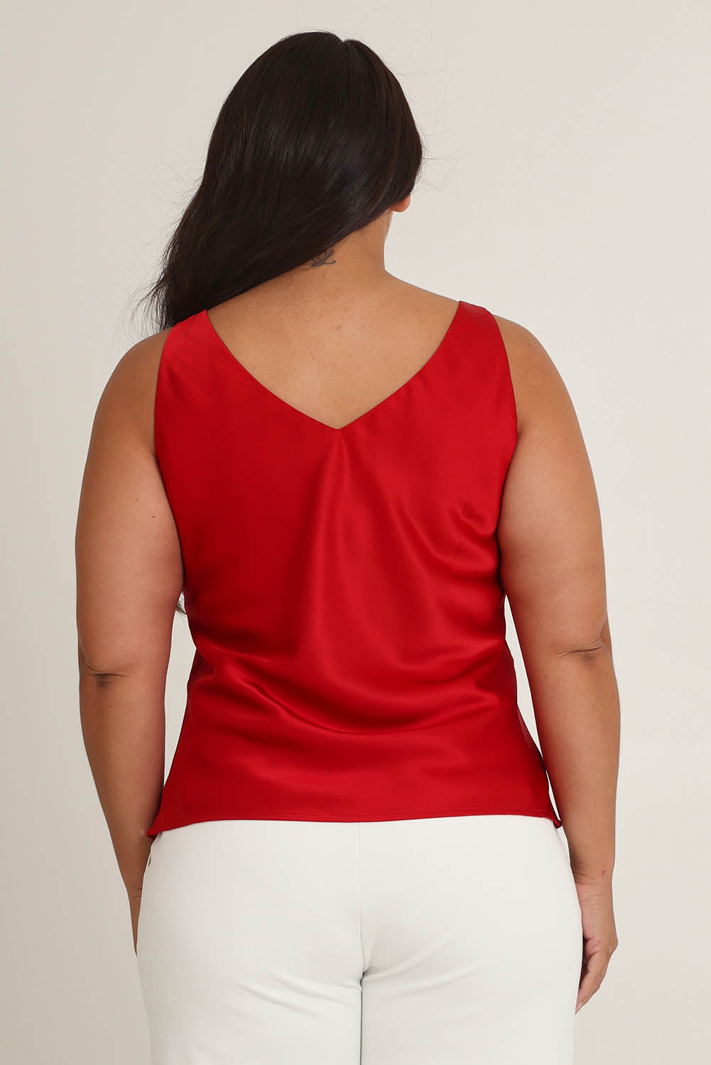 Model Ashleigh wearing size 16 of the Loulou Satin Camisole in colour Red (Red), from the back