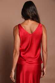 Model Madeline wearing size 10 of the Loulou Satin Camisole in colour Red (Red), from the back