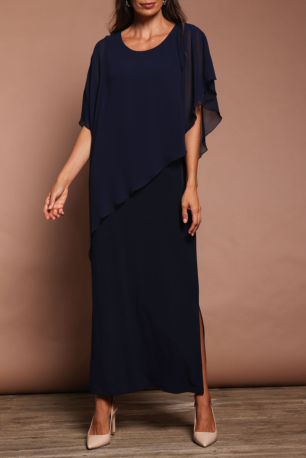 Model Amanda wearing size 10 of The Long Beatrice Dress in colour Navy (Blue), from the front, cropped image