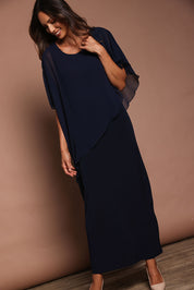 Model Amanda wearing size 10 of The Long Beatrice Dress in colour Navy (Blue), from the front, showing the whole outfit