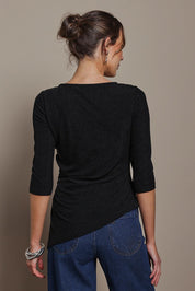 Model Madeline wearing size 10 of the Aisling Top in colour Black (Black), from the back
