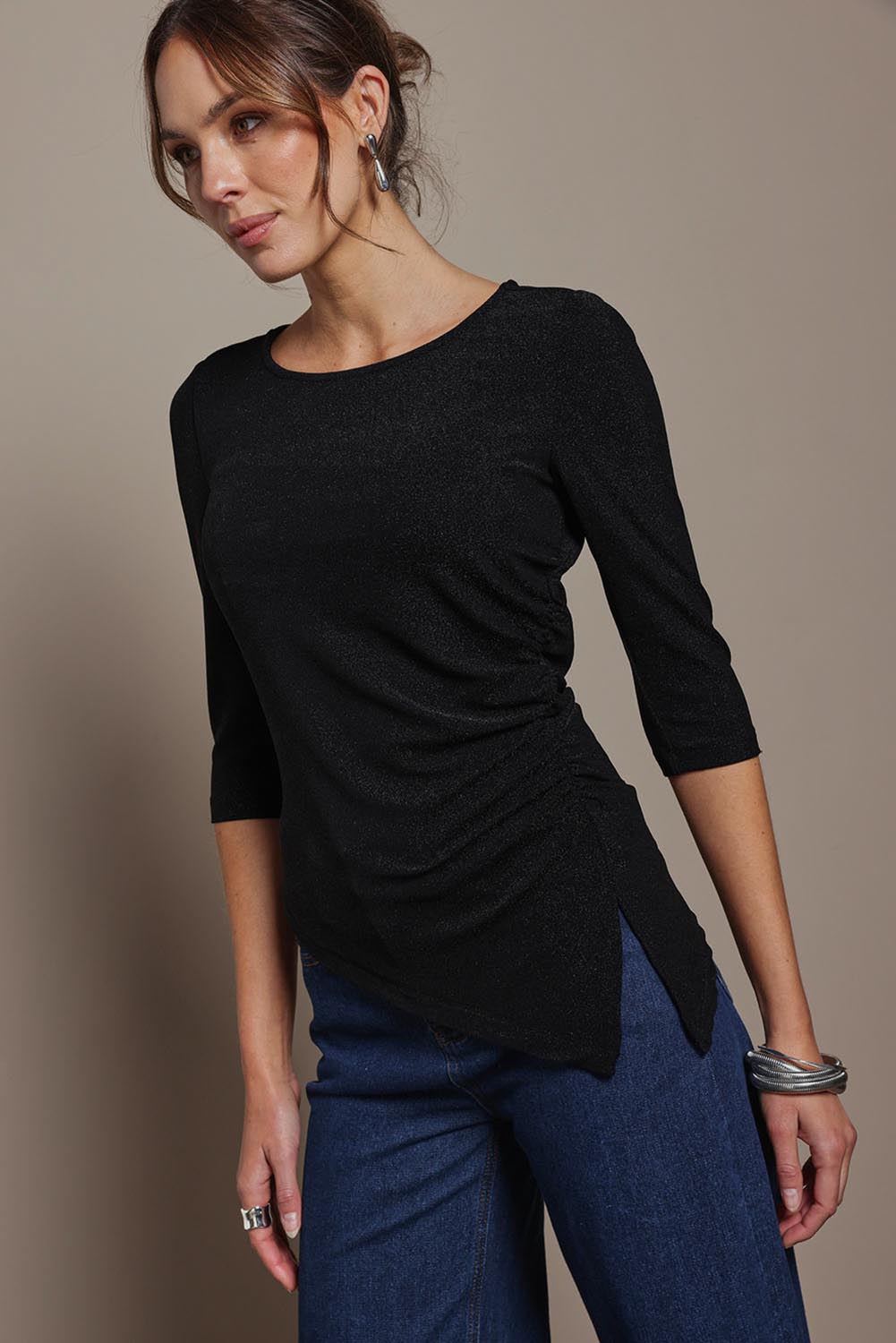 Model Madeline wearing size 10 of the Aisling Top in colour Black (Black), from the front, cropped image