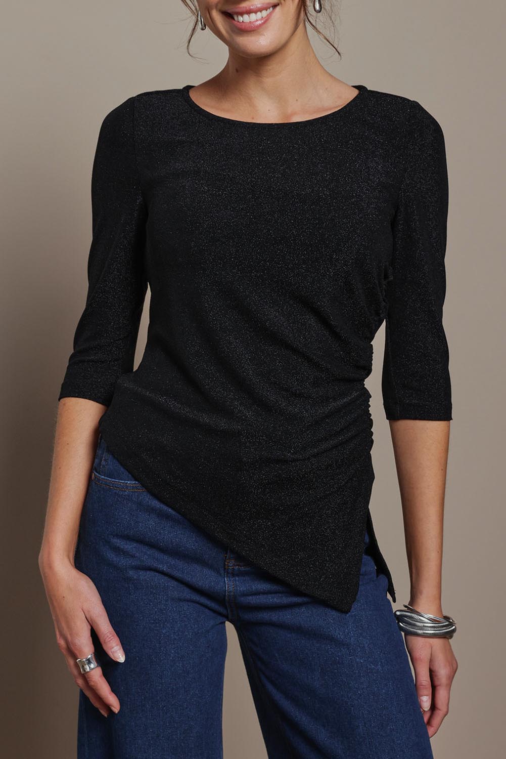 Model Madeline wearing size 10 of the Aisling Top in colour Black (Black), from the front, cropped image
