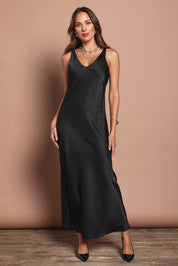 Model Madeline wearing size 10 of the Loulou Satin Slip Dress in colour Black (Black), from the front, showing the whole outfit