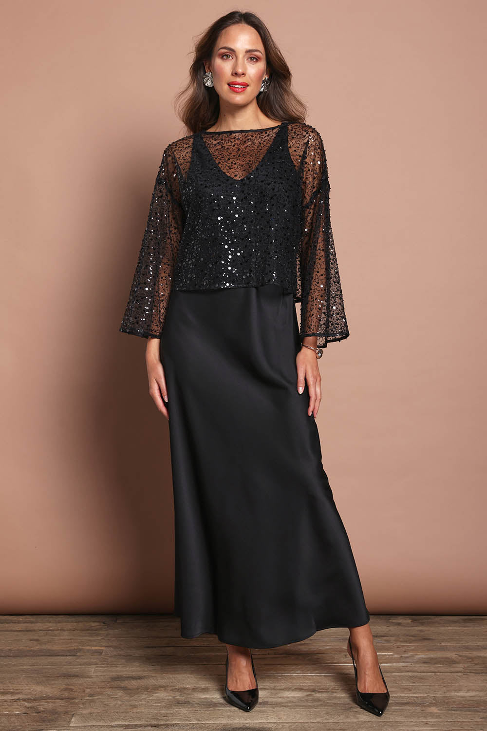 Model Madeline wearing size 10 of the Loulou Satin Slip Dress in colour Black (Black), from the front, showing the whole outfit