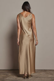 Model Amanda wearing size 10 of the Loulou Satin Slip Dress in colour Latte, from the back