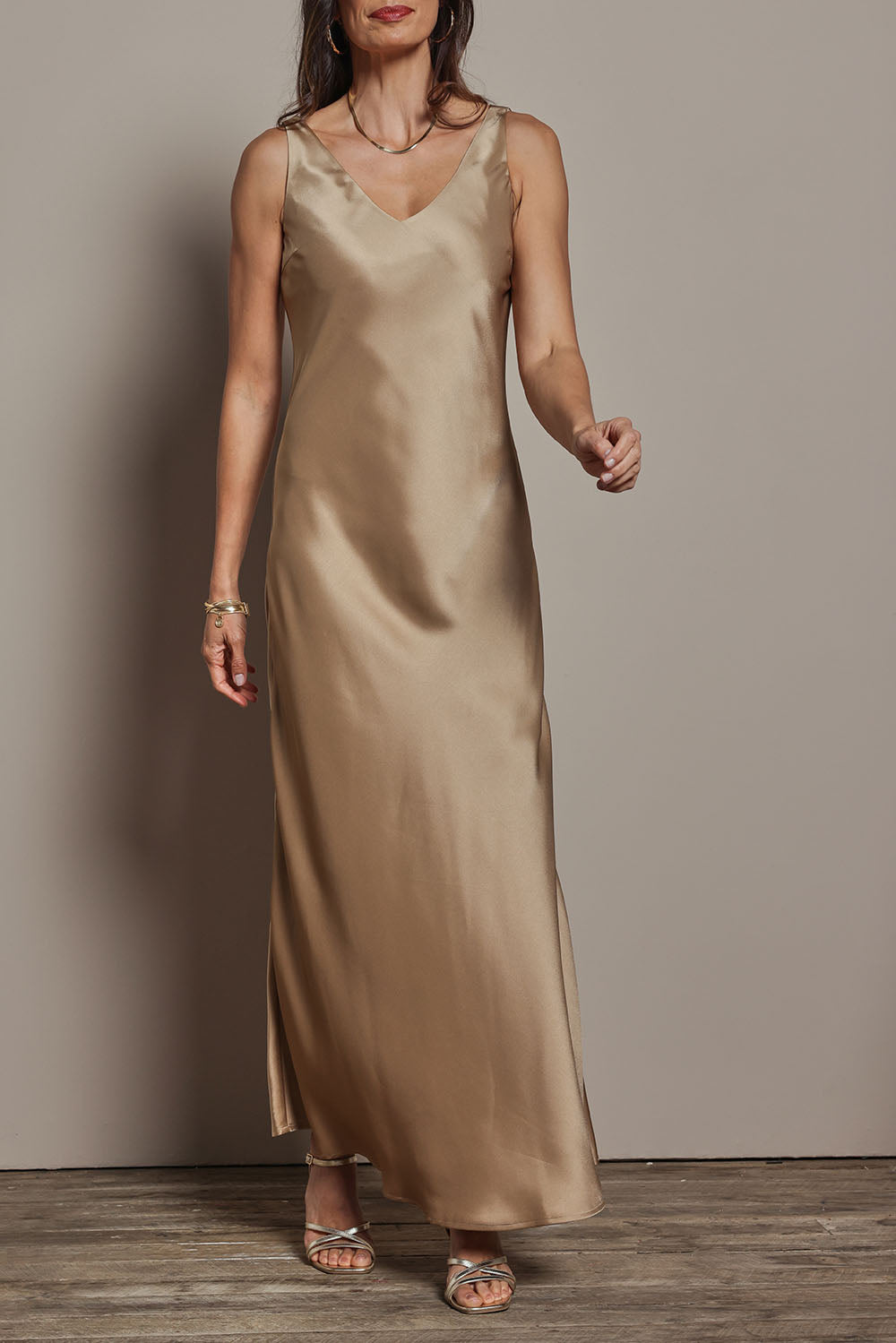 Model Amanda wearing size 10 of the Loulou Satin Slip Dress in colour Latte, from the front, cropped image