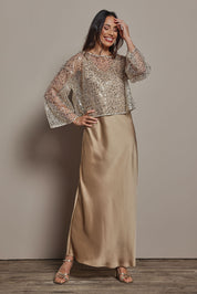 Model Amanda wearing size 10 of the Loulou Satin Slip Dress in colour Latte, from the front, showing the whole outfit