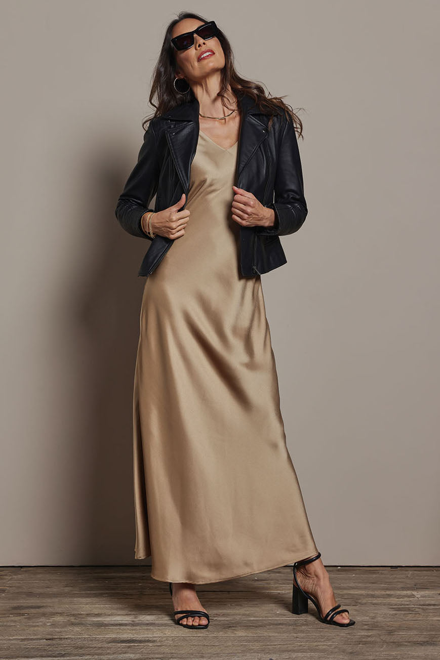 Model Amanda wearing size 10 of the Loulou Satin Slip Dress in colour Latte, from the front, showing the whole outfit