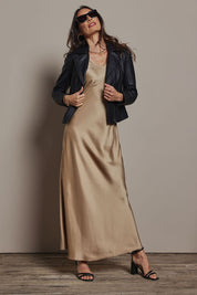 Model Amanda wearing size 10 of the Loulou Satin Slip Dress in colour Latte, from the front, showing the whole outfit